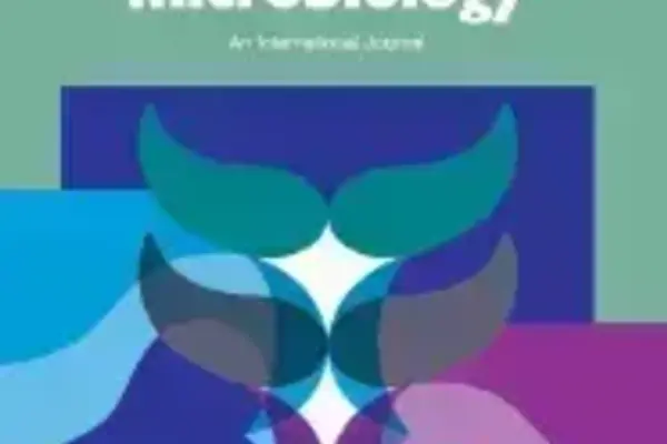 "Veterinary Microbiology" journal cover. Teal background, multi-colored abstract graphic of whale tails.